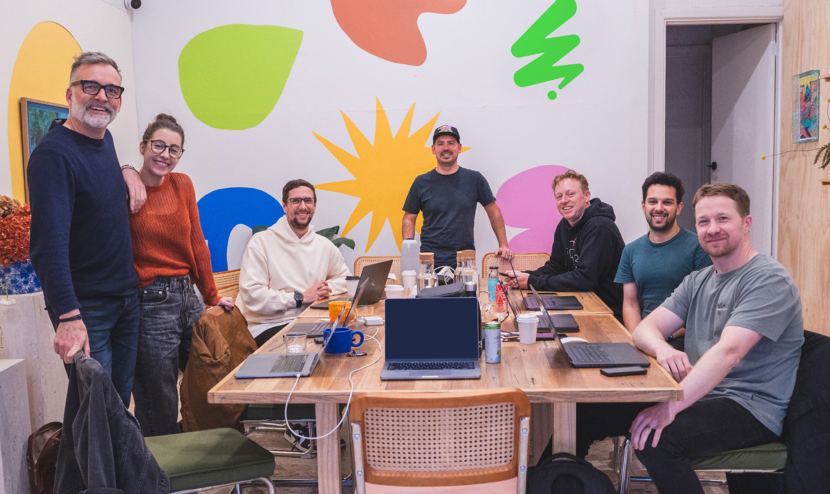 The Umamii team working together around a table
